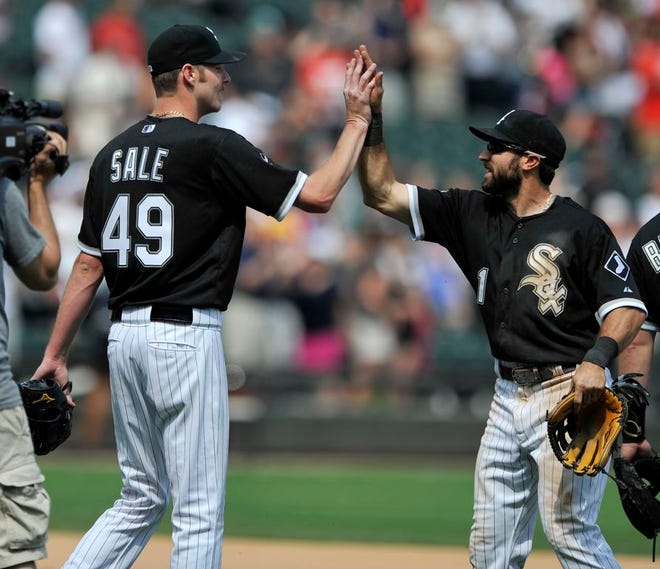 Chicago White Sox starting pitcher Chris Sale (49), celebrates with teammate Adam Eaton (1), after defeating the San Diego Padres 4-1 during an inter league game in Chicago on Sunday.