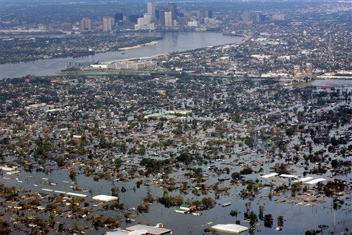 FILE - This Aug. 30, 2005 file photo shows floodwaters from Hurricane Katrina covering a portion of New Orleans. A new psychology study shows that people are wrongly less prone to flee from hurricanes with feminine names. Yet the study finds female named storms have been deadlier in the United States than their macho sounding counterparts. Katrina and Sandy are the two deadliest storms to make landfall in the U.S. since names went co-ed in 1979. The study, which didn't involve experts in meteorology or disaster science, is published Monday in the Proceedings of the National Academy of Sciences. (AP Photo/David J. Phillip, File)