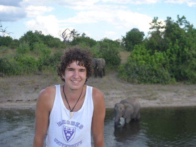 Brian Neumann poses for a photo while on a cruise down the Chobe River in Botswana.