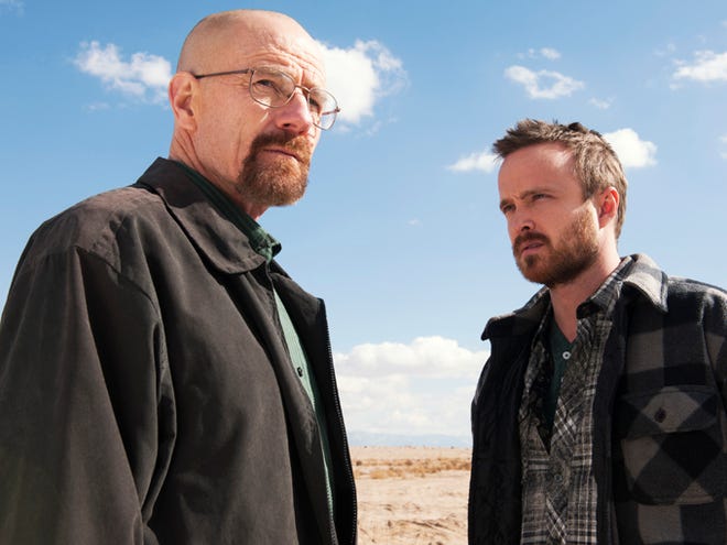 This image released by AMC shows Bryan Cranston as Walter White, left, and Aaron Paul as Jesse Pinkman in a scene from "Breaking Bad." The Nielsen company, for the first time this season, is measuring how many people are reading Twitter messages about particular TV programs the night they are on the air. Nielsen said Monday that the drug-dealing drama starring Cranston had an average of 6 million people seeing tweets for each episode.