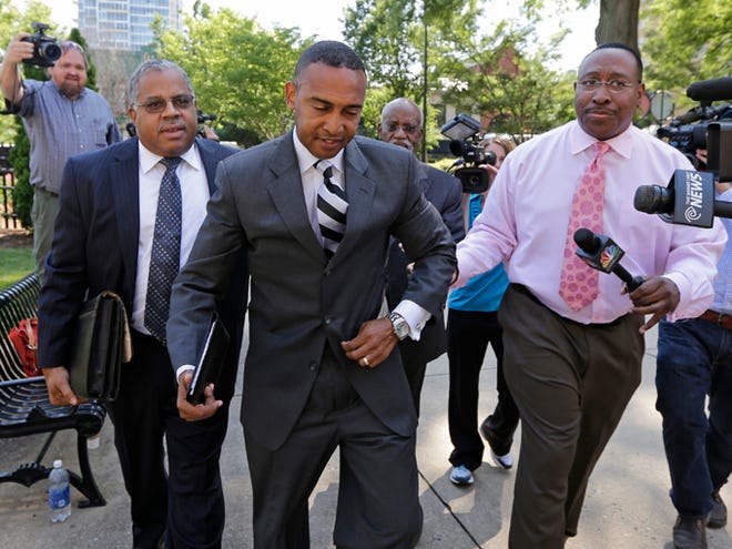 Former Charlotte mayor Patrick Cannon arrives at the federal courthouse Tuesday in Charlotte, N.C. In a deal with prosecutors, Cannon pleaded guilty to one count of honest services wire fraud, which carries a sentence of up to 20 years in prison and a $250,000 fine.