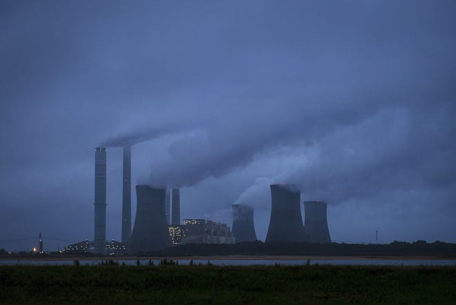 The coal-fired Plant Scherer is shown in operation early Sunday, June 1, 2014, in Juliette, Ga. The Obama administration unveiled a plan Monday to cut carbon dioxide emissions from power plants by nearly a third over the next 15 years, in a sweeping initiative to curb pollutants blamed for global warming. THE ASSOCIATED PRESS