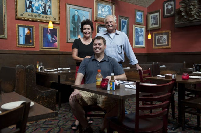 Taylor Sadowski sits with his parents, Pam and Paul, in one of the dining rooms at their restaurant, the Mexican Food Factory, which is marking 35 years in business this year.