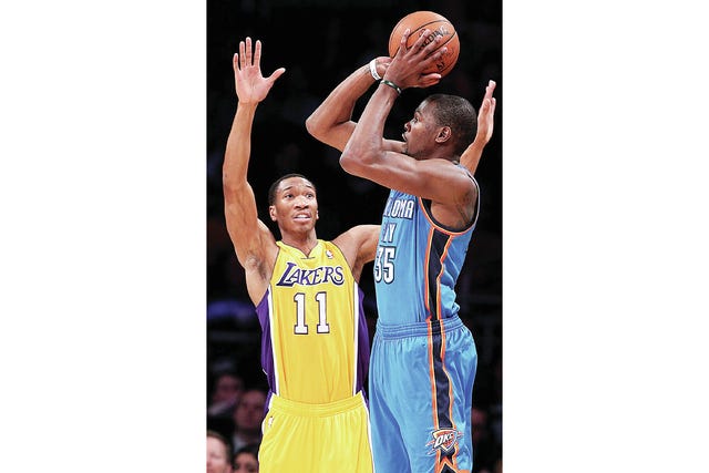 The Oklahoma City Thunder's Kevin Durant shoots over the Los Angeles Lakers' Wesley Johnson (11) in the first quarter at Staples Center in Los Angeles on Feb. 13. (Luis Sinco/MCT)