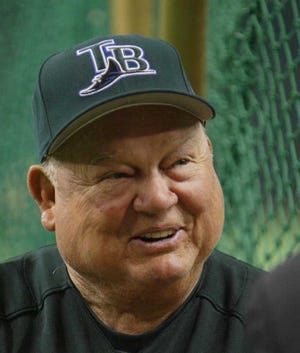 Tampa Bay Devil Rays senior baseball adviser Don Zimmer is interviewed near a batting cage during the team's batting practice prior to the exhibition game against Japan's Hanshin Tigers at Tokyo Dome Sunday, March 28, 2004. Zimmer will try to keep his emotions in check Tuesday when the Devil Rays open the regular season against his former team New York Yankees at the indoor stadium. (AP Photo/Shizuo Kambayashi)