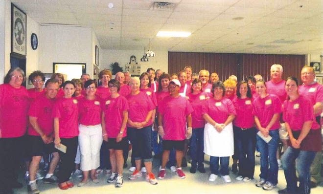 It takes a lot of help to put together the Community Hospice dinner. Here is a group of volunteers from the 2013 event.