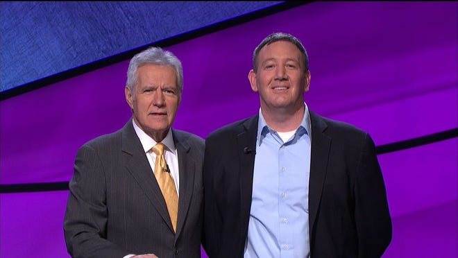 Brian Loughnane of Scituate poses with Jeopardy! Host Alex Trebek.