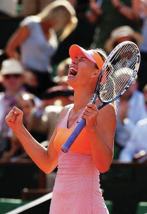 Maria Sharapova of Russia celebrates victory during her women's singles semi-final match against Eugenie Bouchard of Canada on day twelve of the French Open at Roland Garros on Thursday in Paris, France. (Photo by Getty Images)