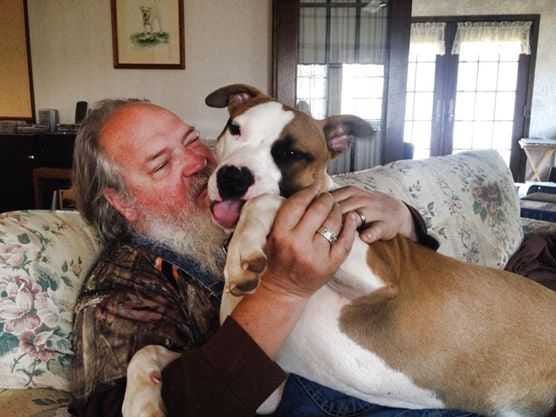 Special/ Mark Jordan plays with his dog Booder in photo posted on his Facebook page. A hearing in Hart County will focus on whether a policeman was justified in killing Booder.