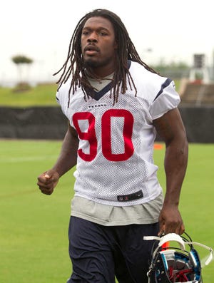 Houston Texans outside linebacker Jadeveon Clowney walks to practice during an NFL football minicamp, Tuesday, May 27, 2014, in Houston. (AP Photo/Patric Schneider)