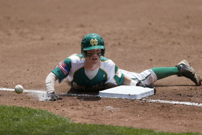 Newark Catholic's Mike Lohr dives into third base in the first inning. Lohr led off the inning with a double, and moved to third and scored on two throwing errors.