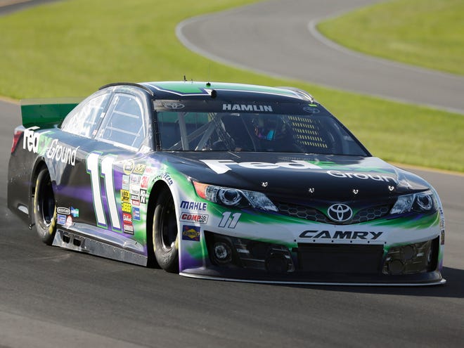 Denny Hamlin qualifies for the pole position for Sunday’s NASCAR Sprint Cup Series race at Pocono Raceway on Friday in Long Pond, Pa.