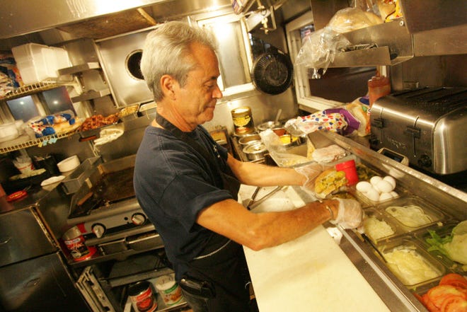 Haven Brothers owner Sal Guisti keeps things moving in the kitchen.
