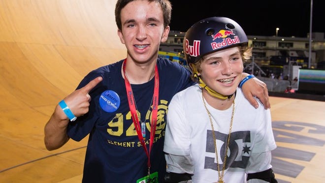 Cameron Copeland, left, celebrates Tom Schaar’s gold medal at Saturday night’s Skateboard Big Air competition. (Photo by Eddie Perlas / ESPN Images)