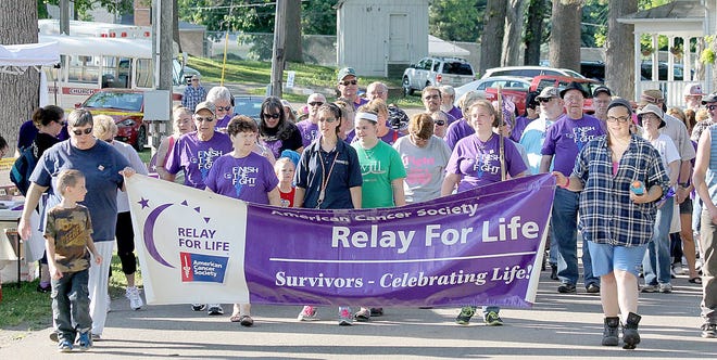 Survivors and caregivers officially kick-off this year's Hillsdale County Relay for Life with the Survivor Lap Friday evening at the Hillsdale County Fairgrounds. ANDY BARRAND PHOTO