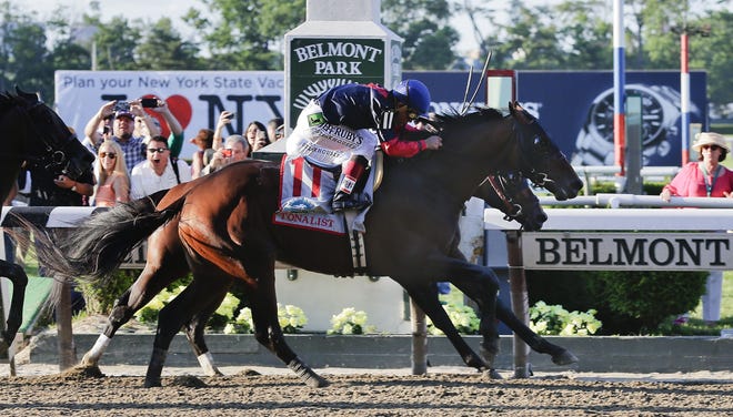 Tonalist (11) with Joel Rosario up edges out Commissioner with Javier Castellano up to win the 146th running of the Belmont Stakes horse race, Saturday, June 7, 2014, in Elmont, N.Y. Belmont Stakes horse race, Saturday, June 7, 2014, in Elmont, N.Y. THE ASSOCIATED PRESS
