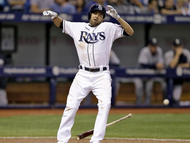 Tampa Bay Rays' David DeJesus reacts after getting hit by a pitch from Seattle Mariners' Tom Wilhelmsen during the seventh inning of a baseball game Friday, June 6, 2014, in St. Petersburg, Fla. (AP Photo/Chris O'Meara)