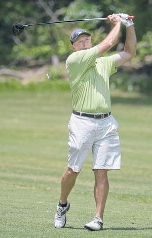 Randy Clayton follows through on his tee shot on the third hole during his first round of the Alamance County Amateur golf championship Friday.