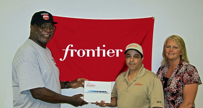 DuWayne Brooks accepts a donation of an iPad from Frontier Communications. It will be one of many prizes raffled off during the DuWayne Brooks Music Festival for Diabetes June 21 at the Rivoli Theatre. COURTESY PHOTO