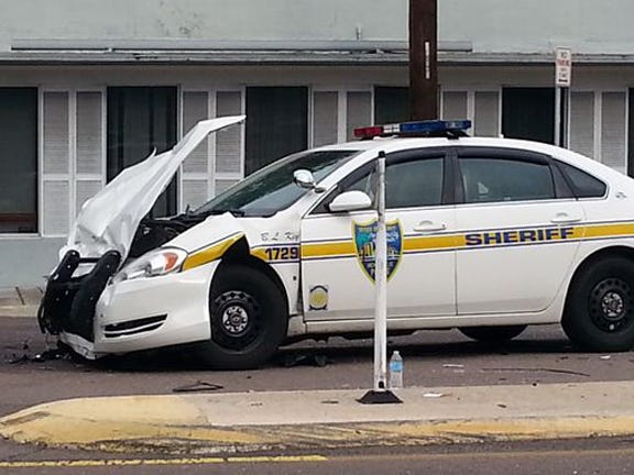 JSO Officer B.L. Key's car was damaged when another car ran a stop sign and into the path of the officer's car.