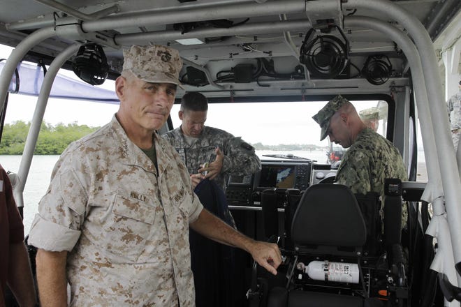 Marine Gen. John F. Kelly, the commander of U.S. Southern Command, arrives at the U.S. Navy base in Guantanamo Bay, Cuba, to visit with troops and meet with officials amid a fierce outcry in Washington over the recent exchange of five Taliban prisoners held at Guantanamo for a captured U.S. soldier Saturday, June 7, 2014.  THE ASSOCIATED PRESS