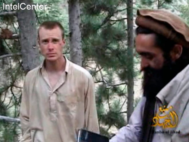 FILE - This file image provided by IntelCenter on Dec. 8, 2010, shows a frame grab from a video released by the Taliban containing footage of a man believed to be Bowe Bergdahl, left. Saturday, May 31, 2014, U.S. officials say Bergdahl, the only American soldier held prisoner in Afghanistan has been freed and is in U.S. custody. The officials say his release was part of a negotiation that includes the release of five Afghan detainees held in the U.S. prison at Guantanamo Bay, Cuba.