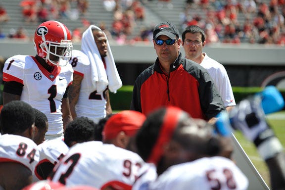 Georgia defensive coordinator Jeremy Pruitt speaks with members Black Team's defense during the first half of the G-Day Georgia spring football game on Saturday, April 12, 2014, in Athens, Ga.