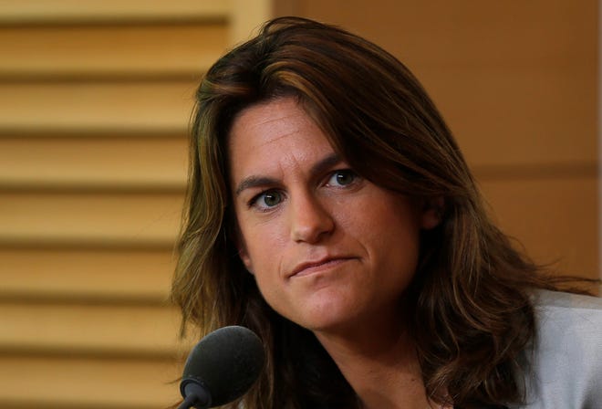 French tennis great Amelie Mauresmo listens during a press conference at the Roland Garros stadium, in Paris, France, Sunday, June 8, 2014. Britain's Andy Murray has appointed Mauresmo as his coach Sunday. The Wimbledon champion, who lost to Rafael Nadal in the French Open semifinals on Friday, will work with Maursemo at least through the grass-court season. (AP Photo/Michel Spingler)
