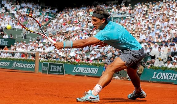 AP photo
Spain's Rafael Nadal returns the ball to Serbia's Novak Djokovic during their final match of the French Open tennis tournament at the Roland Garros stadium, in Paris, France, on Sunday.