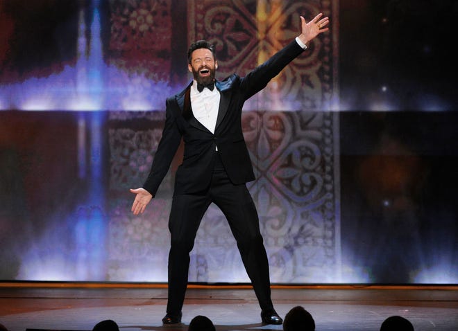 Host Hugh Jackman performs on stage at the 68th annual Tony Awards at Radio City Music Hall on Sunday, June 8, 2014, in New York. THE ASSOCIATED PRESS
