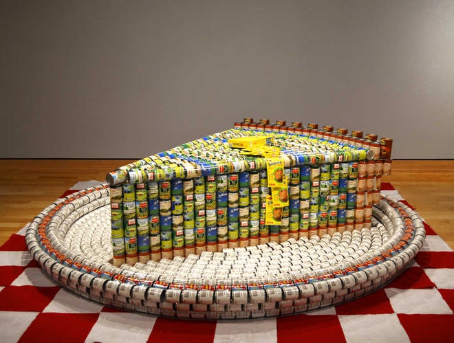 "Slice of Pea-Can Pie," created by Bartlett & West, won the Jurors Favorite award at Harvesters' 2014 Canstruction competition. The sculpture uses 2,953 cans of nonperishable food items.