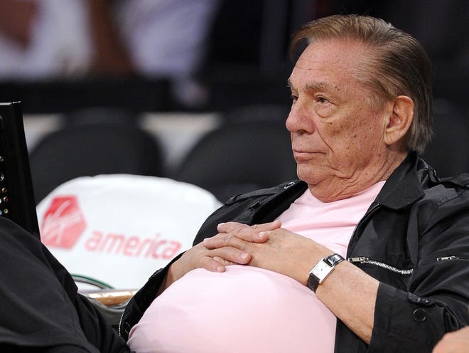In this Oct. 17, 2010, file photo, Los Angeles Clippers team owner Donald Sterling watches his team play in Los Angeles. Sterling has pulled his support from a deal to sell the team to former Microsoft CEO Steve Ballmer and will pursue his $1 billion federal lawsuit against the NBA, his attorney said Monday, June 9, 2014. THE ASSOCIATED PRESS
