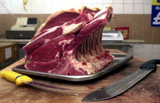 This Nov. 30, 1999 file photo, shows a rib of English beef with the bone still on in Wotton-Under-Edge, England. Women who often indulge their cravings for hamburgers, steaks and other red meat may have a slightly higher risk of breast cancer, a new study suggests. Doctors have long warned that a diet loaded with red meat is linked to cancers including those of the colon and pancreas, but there has been less evidence for its role in breast cancer. (AP Photo/PA, Barry Batchelor, File) UNITED KINGDOM OUT NO SALES NO ARCHIVE