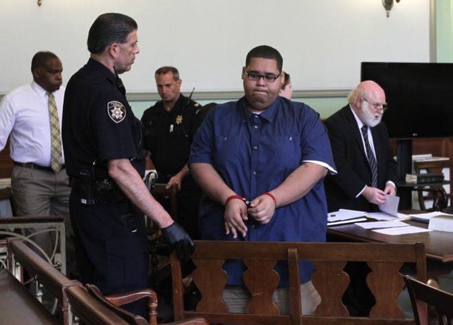 Luis "Fat Boy" Gonzalez is handcuffed and led away after the verdicts were read in court Tuesday. He was found innocent of murder, but guilty on eight other charges.