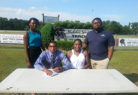 Recent New Bern High graduate Quincy Rasin (front row, left) signed his National Letter of Intent Wednesday to run track at Wagner College. Rasin was joined by his mother Renita Brooks, sister Tamara Dove and brother Phillip Brooks.