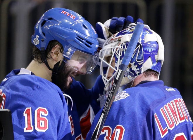 Derick Brassard, left, congratulates goalie Henrik Lundqvist after the Rangers beat the Kings in Game 4 on Wednesday night at Madison Square Garden.