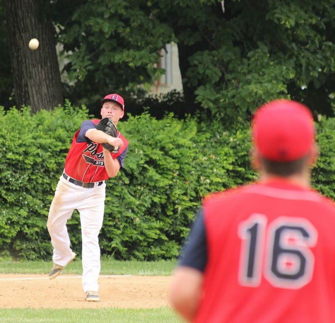 Greencastle third baseman Thomas Bowers throws to first baseman Quin Ambeault (16) for an out during the third inning of Tuesday's Franklin County American Legion League baseball game against St. Thomas at Jerome King Playground.