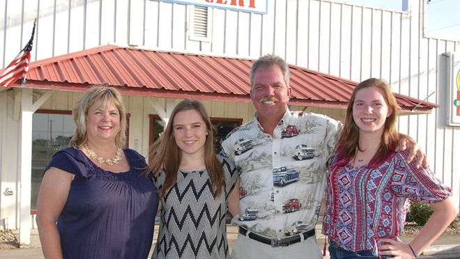 Haley Goertz, second from left, was valedictorian of Bastrop High School Class of 2014. She is pictured with proud parents, Cindy and George Goertz (owners of Rockne Grocery) and sister MaKayla, right.