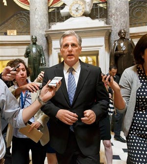 House Majority Whip Kevin McCarthy, R-Calif., leaves House Speaker John Boehner's office on the day after House Majority Leader Eric Cantor, R-Va., was defeated in the Virginia primary at the hands of a tea party challenger, at the Capitol in Washington, Wednesday, June 11, 2014. McCarthy, the third-ranking GOP leader, informed fellow Republicans he intended to run to succeed Cantor, officials said. "I think he'd make an outstanding majority leader," Cantor said of McCarthy. "And I will be backing him with my full support." (AP Photo/J. Scott Applewhite)