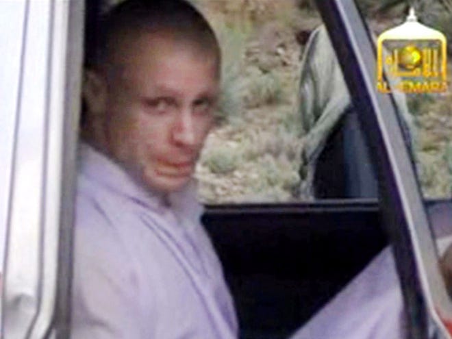 In this image taken from video obtained from Voice Of Jihad Website, which has been authenticated based on its contents and other AP reporting, Sgt. Bowe Bergdahl sits in a vehicle guarded by the Taliban in eastern Afghanistan. Bergdahl is scheduled to arrive at Brooke Army Medical Center in Texas on Friday, a defense official said.