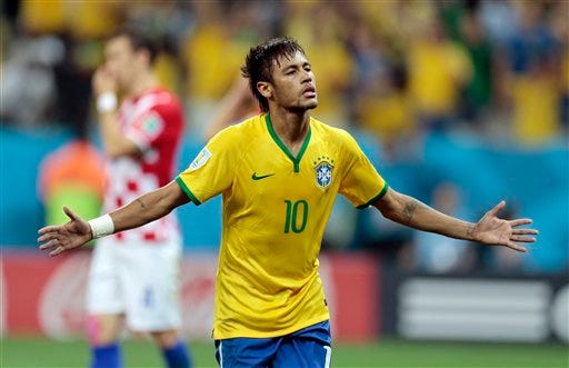 Brazil's Neymar celebrates his second goal on a penalty kick during the group A World Cup soccer match between Brazil and Croatia, the opening game of the tournament, in the Itaquerao Stadium in Sao Paulo, Brazil, Thursday, June 12, 2014.