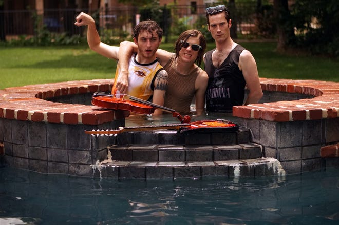 From left, John Calvin, Michael Loveland and Sean Barker pose for a Poolboy band photo during a music video shoot. Photo by Tim Katzenmeier.