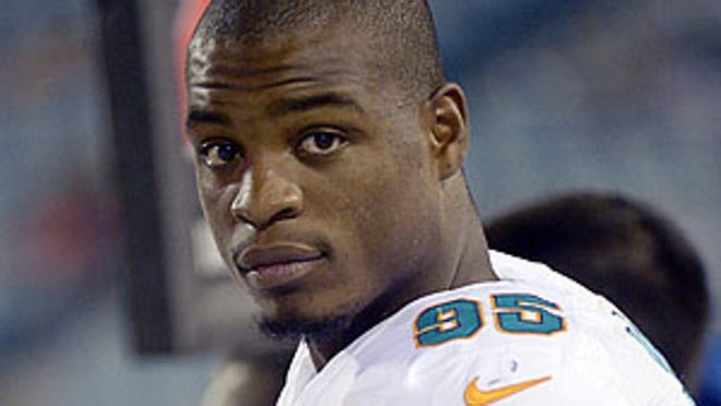 FILE - In this Aug. 9, 2013, Miami Dolphins defensive end Dion Jordan (95) watches from the sideline during the second half of an NFL preseason football game against the Jacksonville Jaguars in Jacksonville, Fla. After sitting out most of practice for a second consecutive week, the Dolphins first-round pick says he might not be ready for the start of the regular season. (AP Photo/Phelan M. Ebenhack, File)