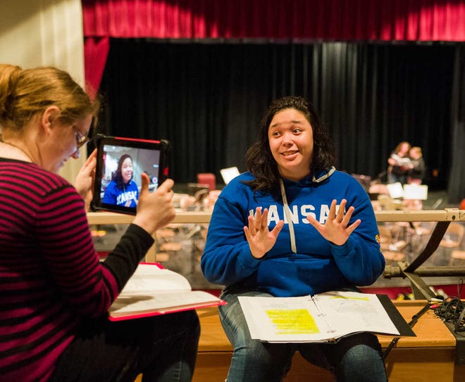Heather King, left, who plays Mya, and Cynthia Gross, who plays Elena, rehearse at Highland Park on Thursday. Both said they cried for about 15 minutes when they heard the school had received a grant and an anonymous donation that would enable the students to perform their production in Scotland.