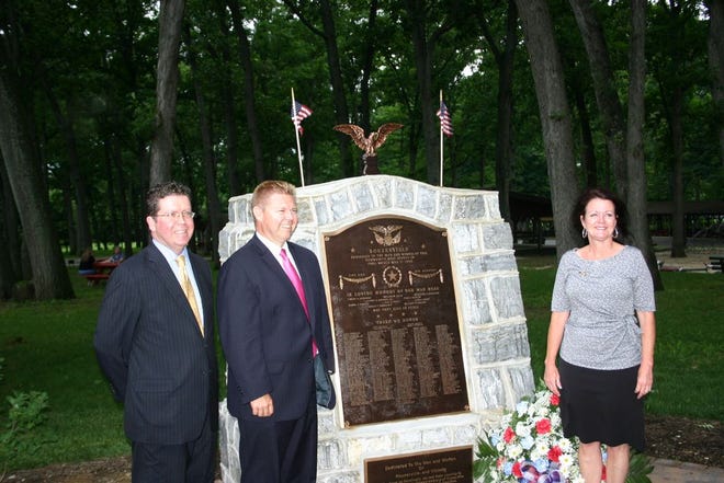 Guest speakers gathered around the rebronzed Rouzerville memorial during Wednesday’s rededication ceremony. From left: David Keller, chairman of the Franklin County commissioners, Pennsylvania Sen. Richard Alloway; and Nancy Bull, who represented U.S. Rep. Bill Shuster’s office.