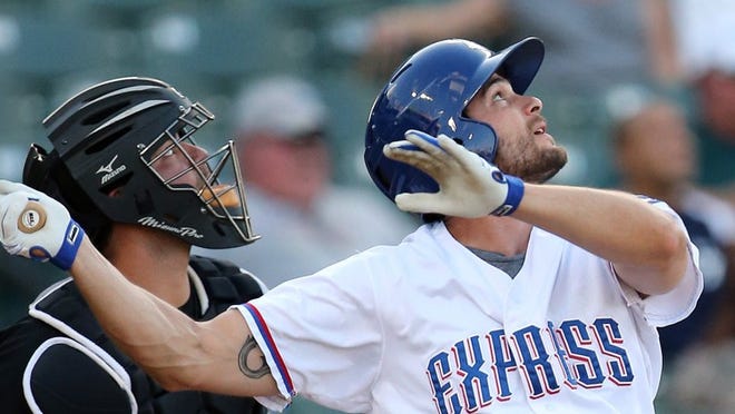 Express right fielder Brad Snyder and Omaha catcher Jesus Flores watch a high hit ball fall foul at Dell Diamond on Monday, June 2, 2014. Jamie Harms / for Round Rock Leader
