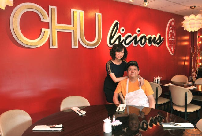 Sheri Chu and her father, Chun Chu, in the front entranceway of their Mount Laurel restaurant CHUlicious.