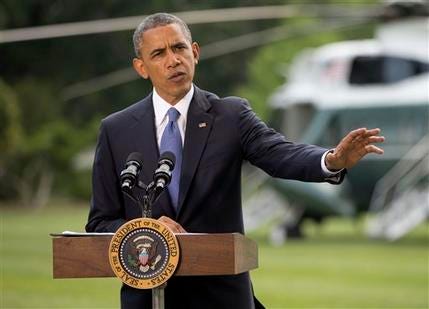President Barack Obama talks about his administration's response to a growing insurgency foothold in Iraq, Friday, June 13, 2014, on the South Lawn of the White House in Washington, prior to boarding the Marine One Helicopter for Andrews Air Force Base, Md., then onto North Dakota and California.