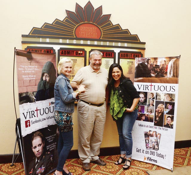 Brandy Allison, left, and Angelita Nelson, two stars of ‘Virtuous,’ pose with Larry Poole of Asheboro after the film’s screening at the Sunset Theatre in Asheboro Thursday. (PJ Ward-Brown / The Courier-Tribune) 
 From left, Autumn Keeter, 14, Sara Garner, 14, Alexandria Lucas, 14, Bailey Thomas, 14, and Madison Poole, 14, of Asheboro pose with Brandy Allison ,second from left, and Angelita Nelson, second from right, at the film screening of the movie "Virtuous" at the Sunset Theatre on Thursday, June 12, 2014 in Asheboro. (PJ Ward-Brown / The Courier-Tribune) 
 Joann Keeter, left, of Asheboro enjoys talking with Brandy Allison and Angelita Nelson after the film screening of the movie "Virtuous" at the Sunset Theatre on Thursday, June 12, 2014 in Asheboro. (PJ Ward-Brown / The Courier-Tribune) 
 Enjoying the end of the night, Brandy Allison and Angelita Nelson have a little fun at the film screening of the movie "Virtuous" at the Sunset Theatre on Thursday, June 12, 2014, in Asheboro. (PJ Ward-Brown / The Courier-Tribune)
