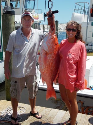 David and Heather Rone show off a 30.4-pound red snapper caught during the nine-day season.